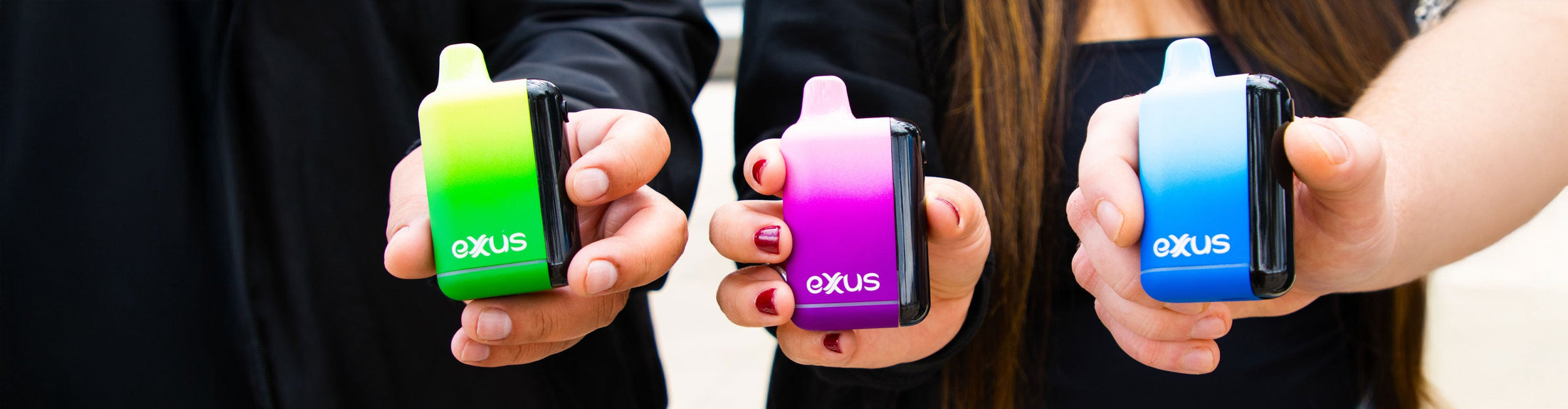 Woman holding Exxus Micare Vape Pen out in a nature park adventure