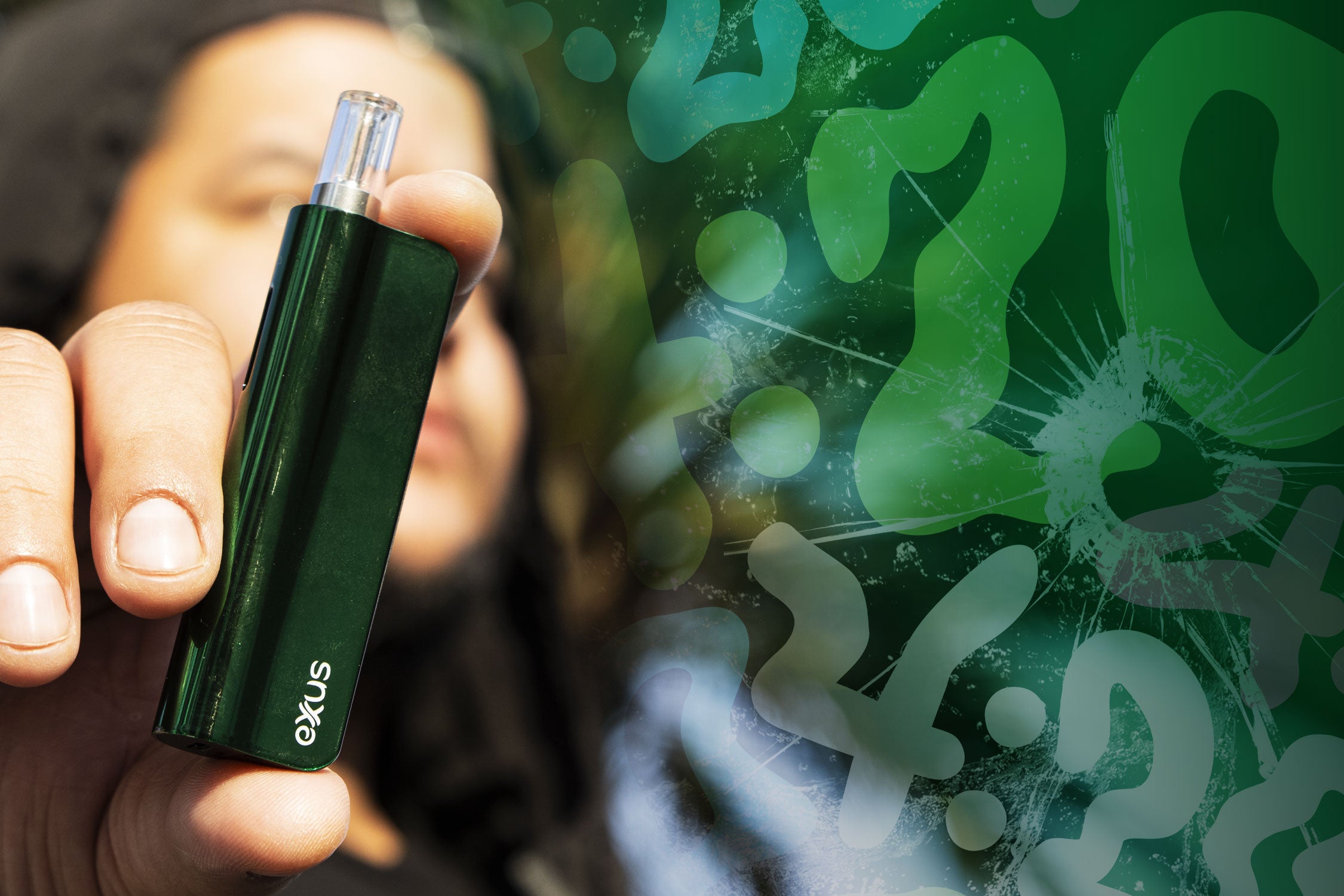 Man holding Exxus Snap VV in front of cracked green 420 texture